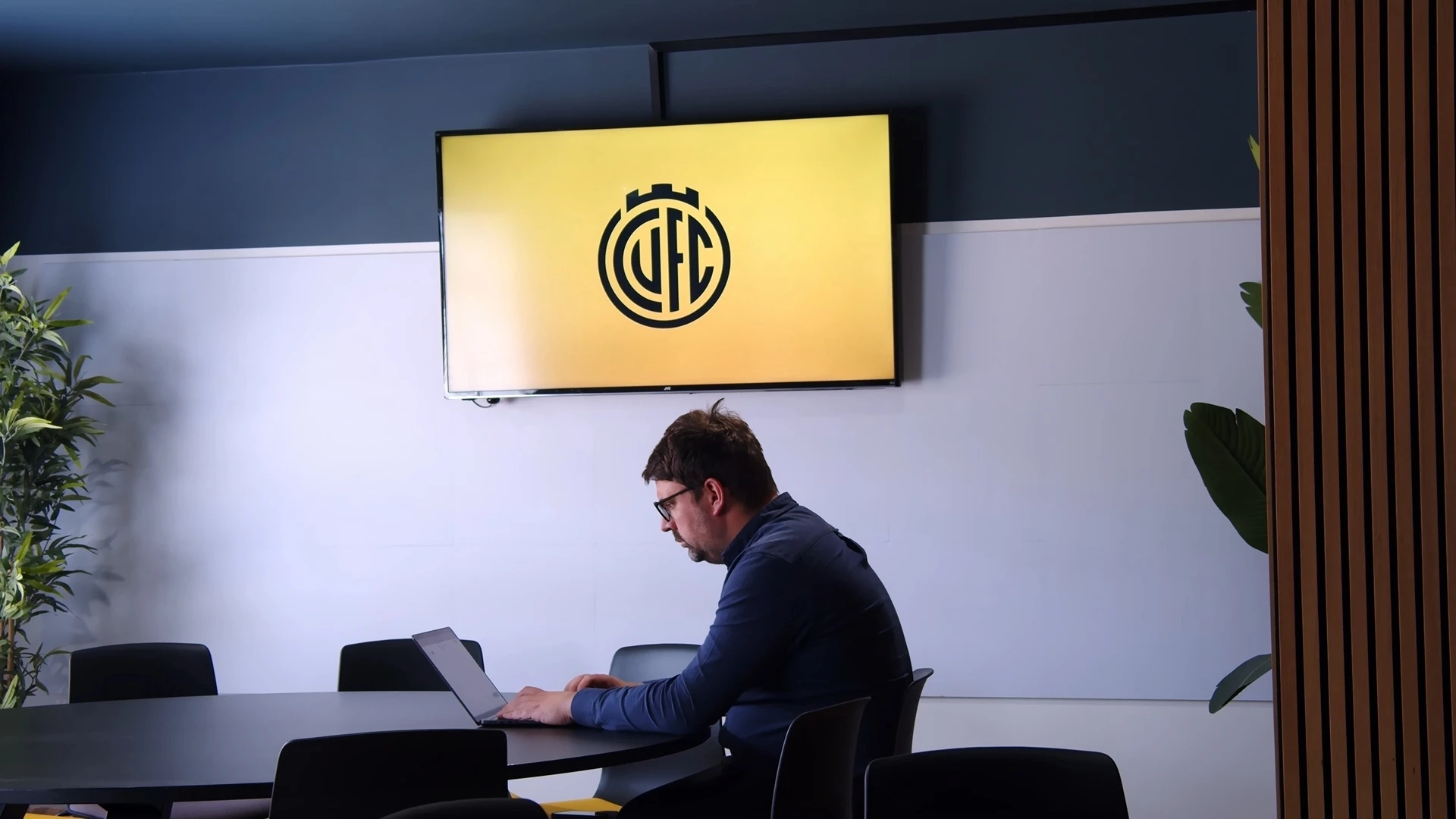 Reviewing a contract in GenieAI on a multi-monitor workstation