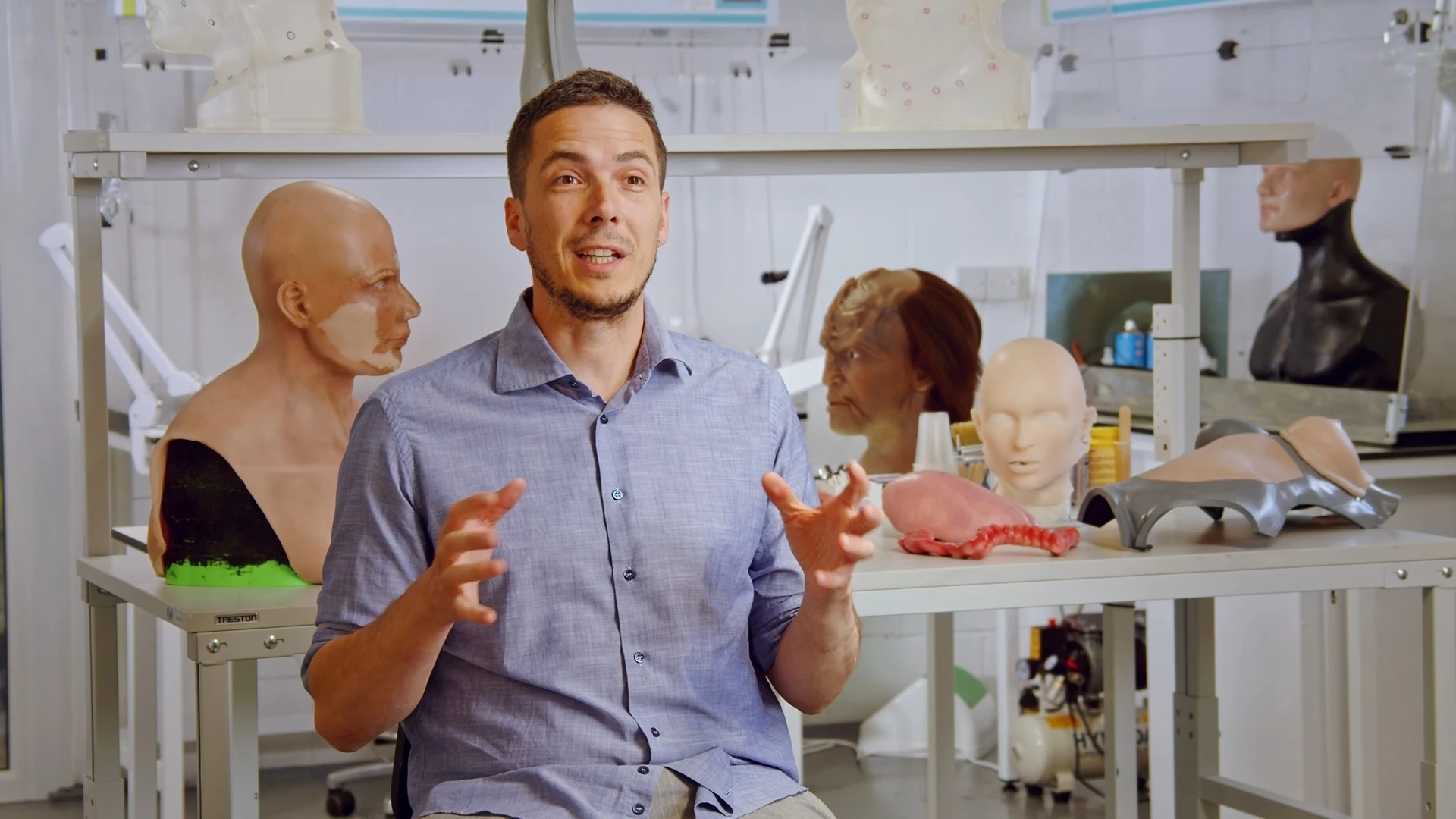 Co-founder describing the product in the prosthetics workshop