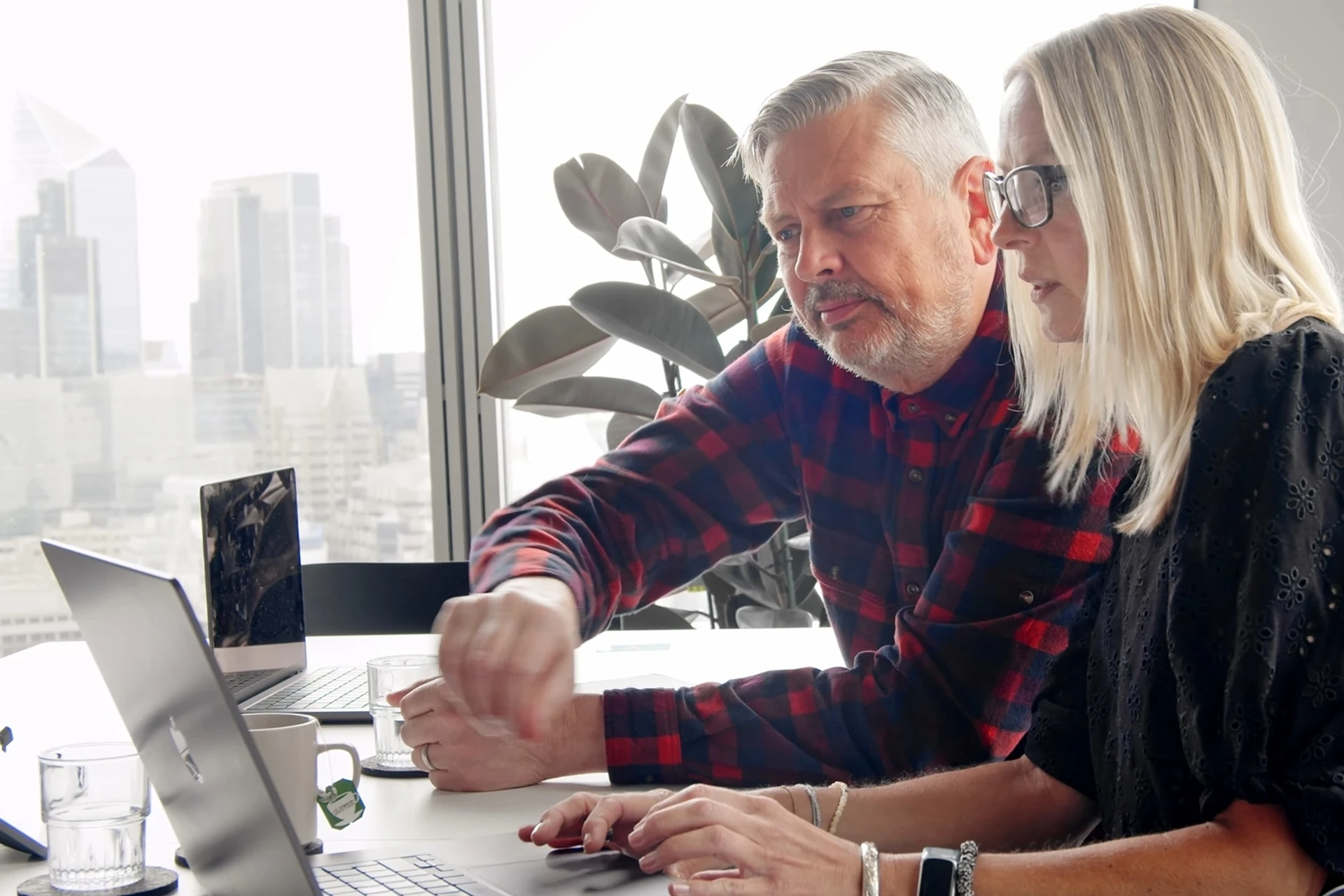 Richard Owen and Jude Legg reviewing a contract together in GenieAI