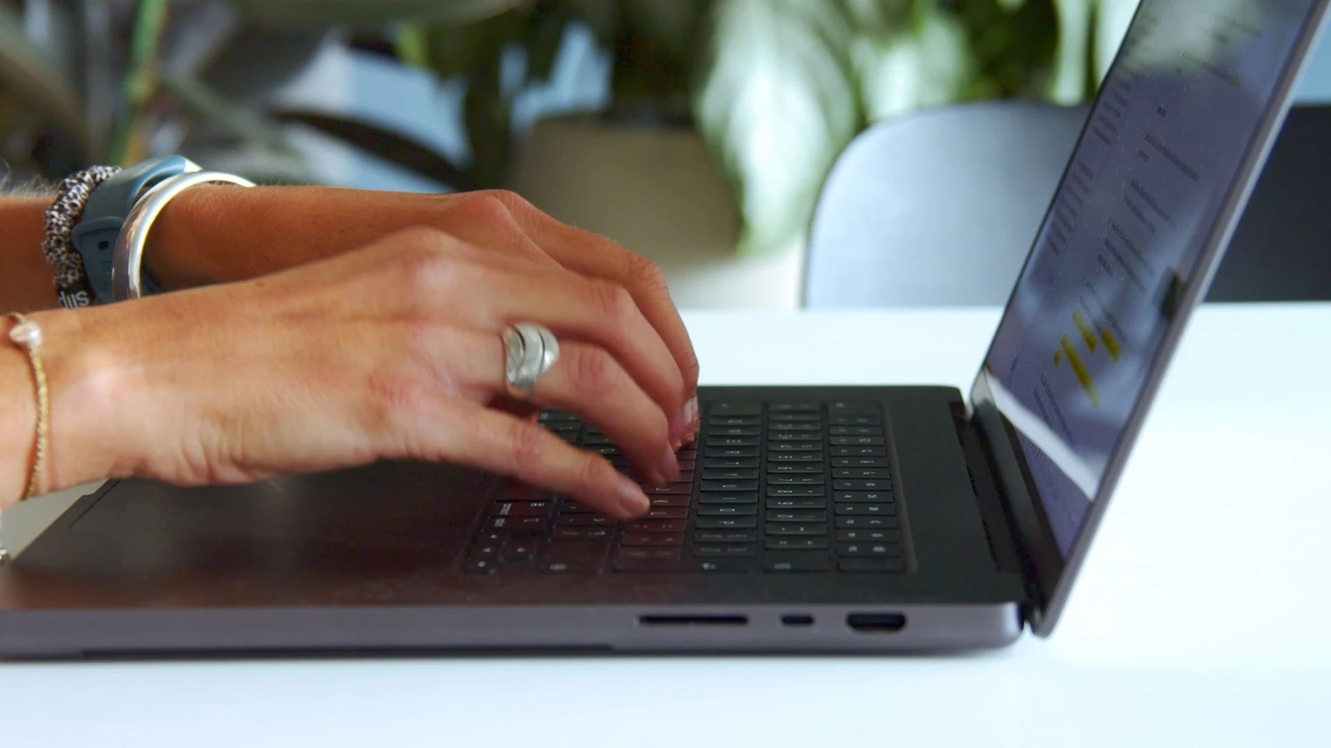 Drafting a contract on a MacBook - close-up of typing